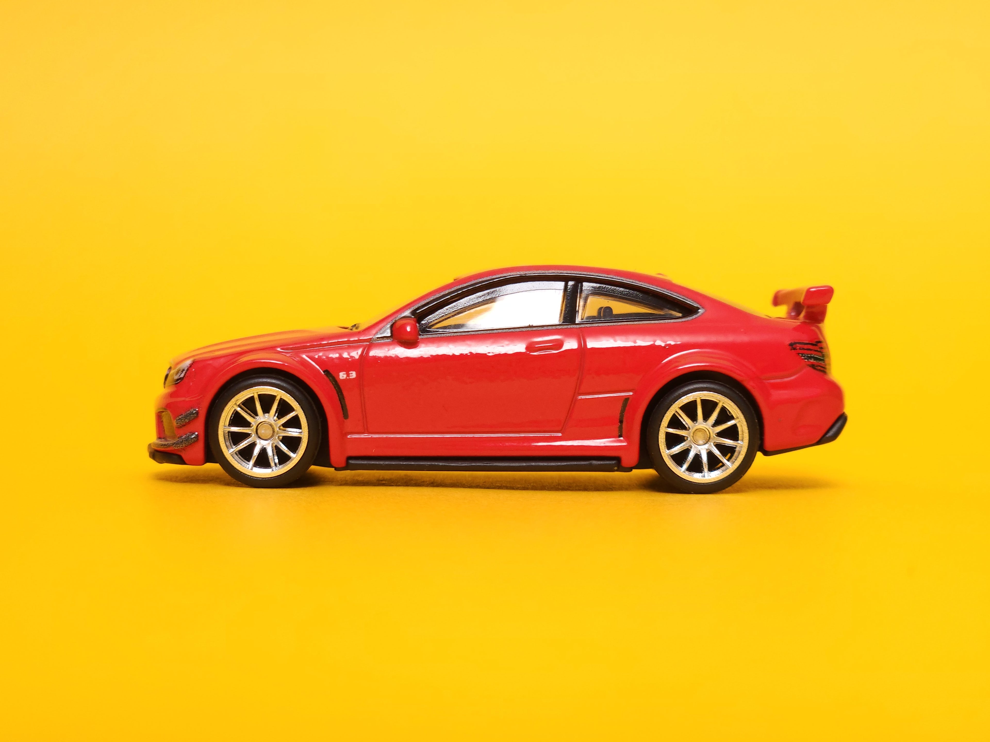 2012 Mercedes-Benz C 63 AMG Coupe Black Series: Fire Opal – 2022 Mattel Hot Wheels Premium 1st Edition