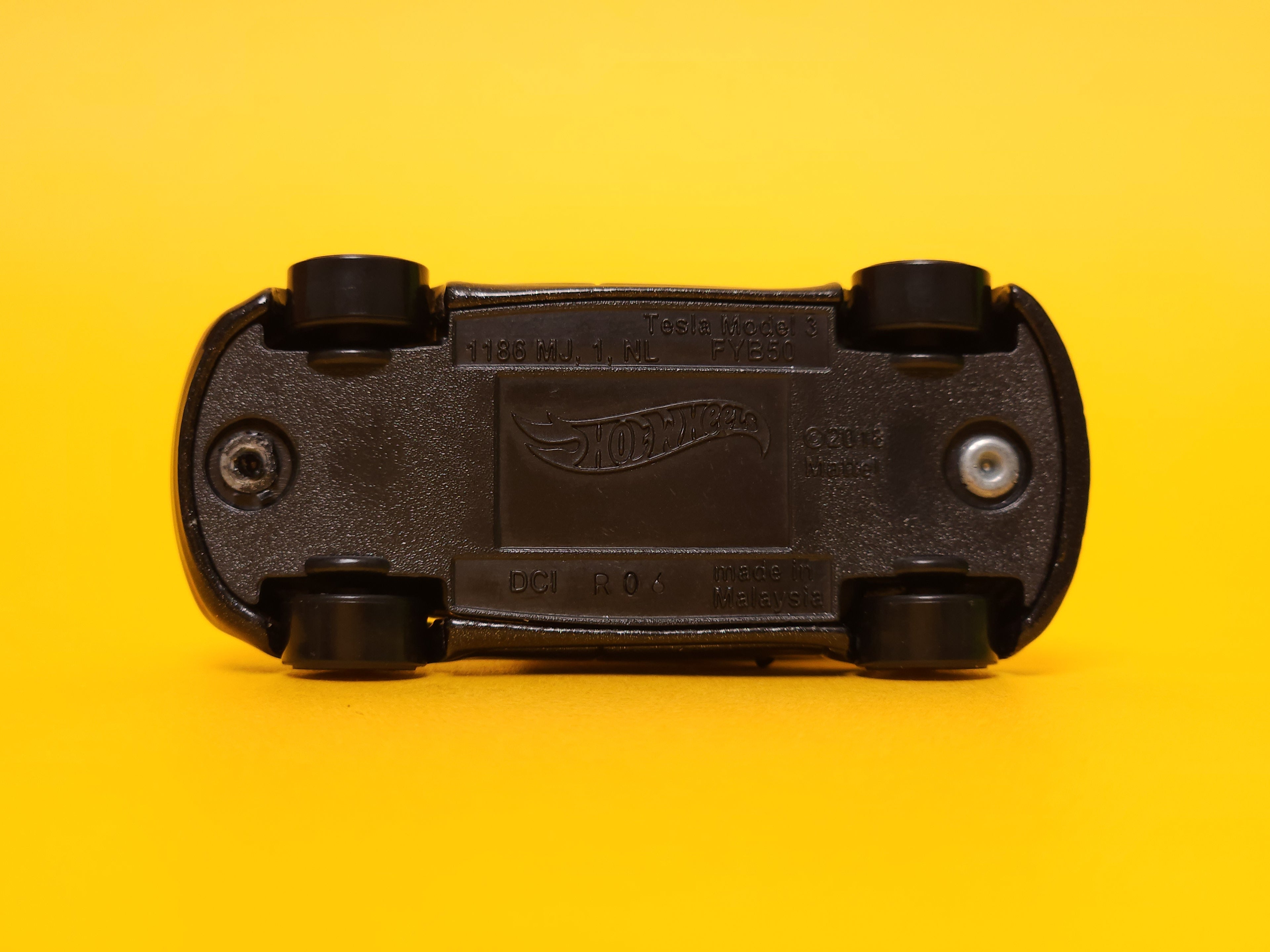 Tesla Model 3: Obsidian Black Metallic – 2022 Mattel Hot Wheels Silver