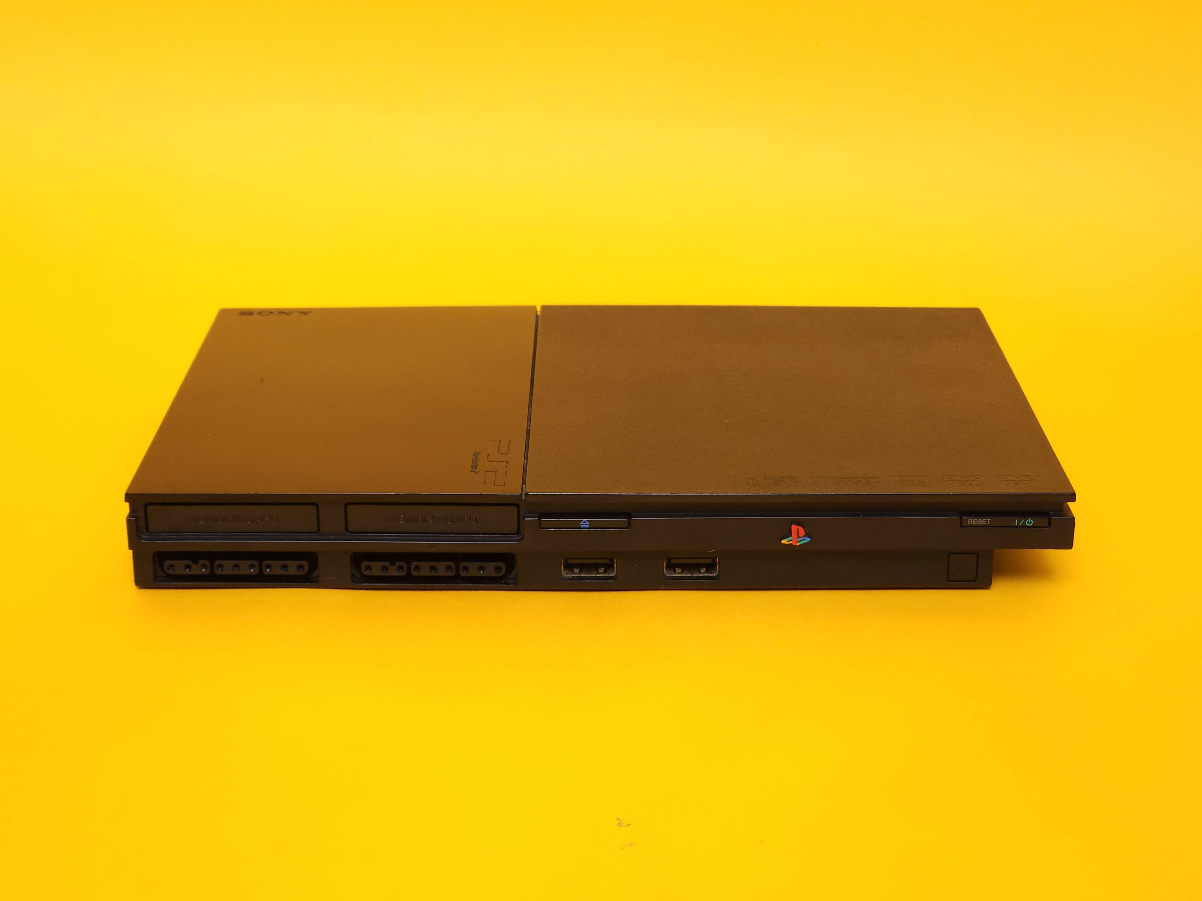 Black PlayStation 2 Slimline Console + Controller & Cables