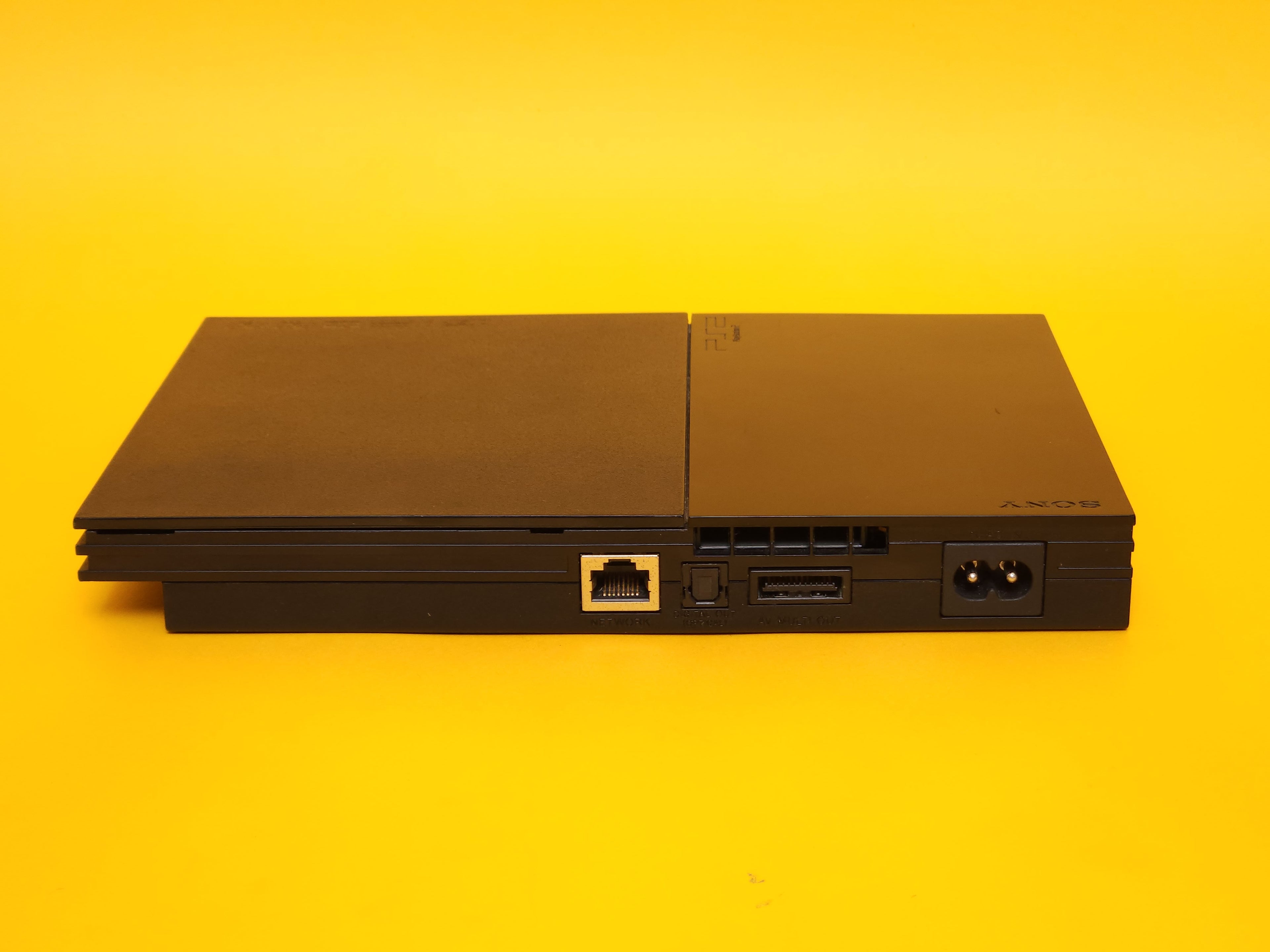 Black PlayStation 2 Slimline Console + Controller & Cables